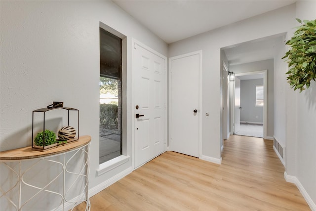 entryway with light hardwood / wood-style floors