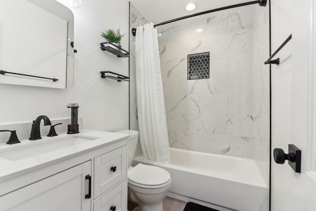 full bathroom featuring shower / bath combo, toilet, and vanity