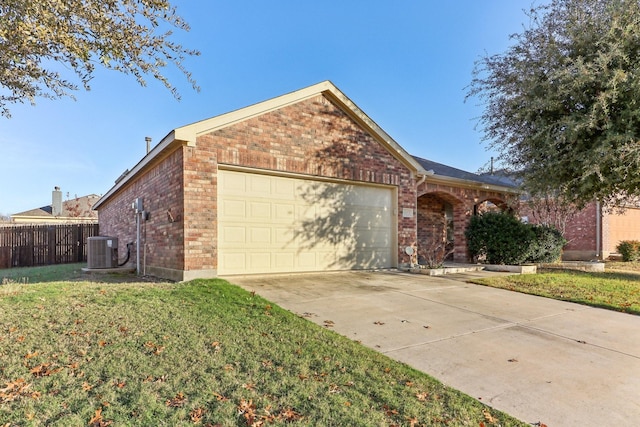 view of front of property with central AC unit and a front yard