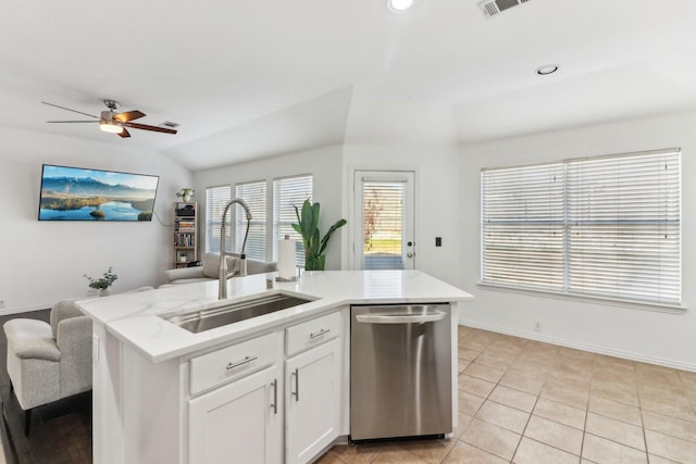 kitchen with white cabinetry, dishwasher, ceiling fan, sink, and a center island with sink