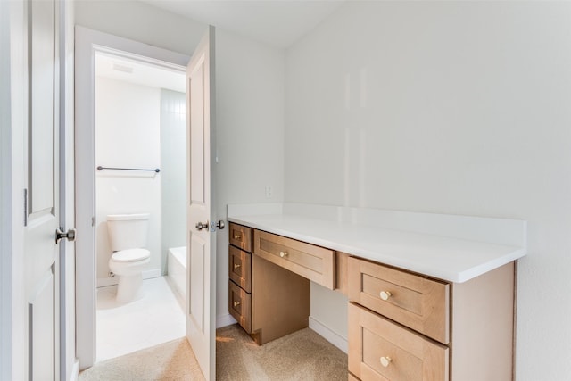 bathroom featuring a bathing tub and toilet