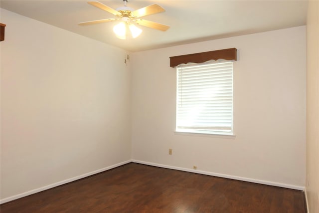 spare room featuring ceiling fan and dark hardwood / wood-style floors