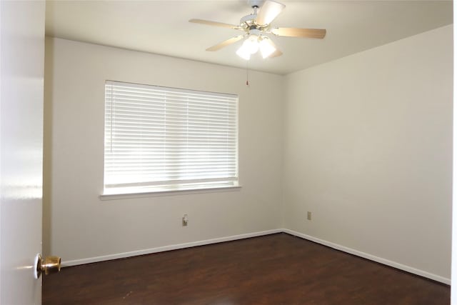 empty room featuring ceiling fan and dark wood-type flooring