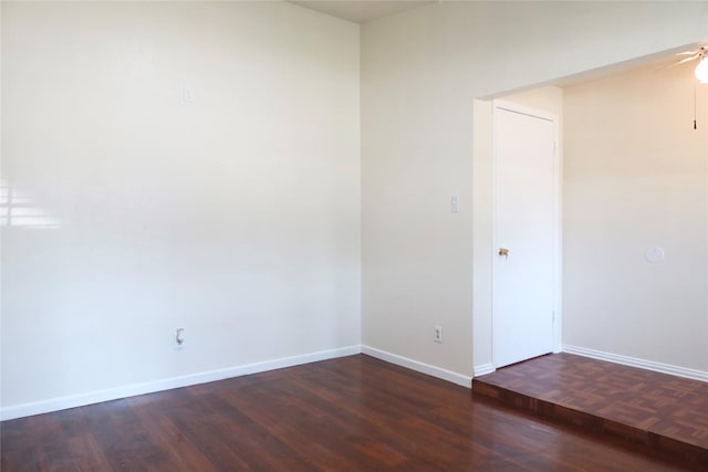 unfurnished room featuring ceiling fan and dark hardwood / wood-style flooring