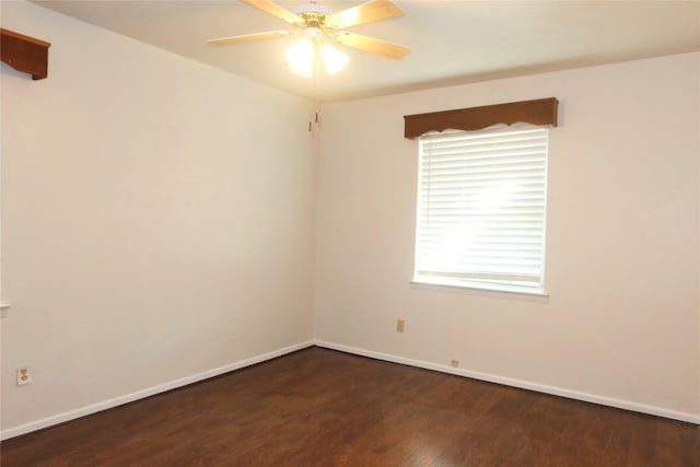 empty room featuring ceiling fan and dark hardwood / wood-style flooring