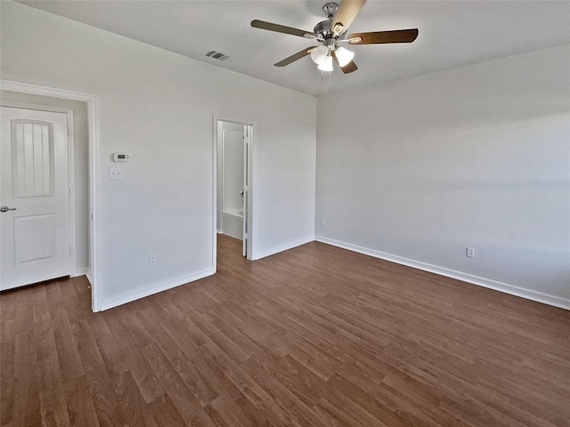 unfurnished bedroom featuring ceiling fan and dark wood-type flooring