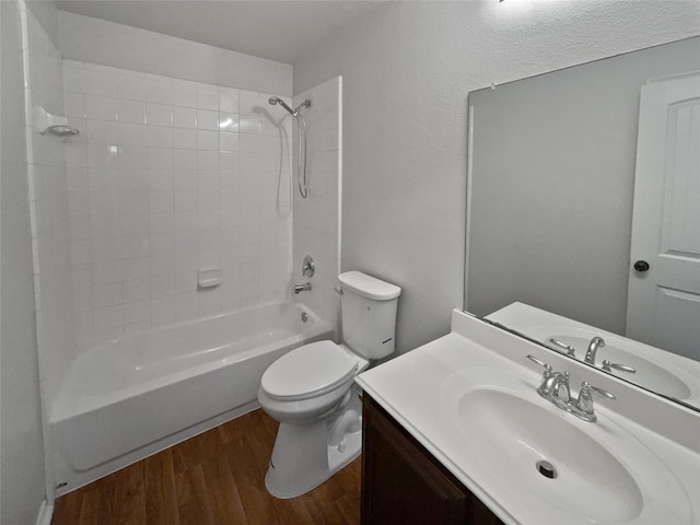 full bathroom featuring toilet, vanity, wood-type flooring, and tub / shower combination