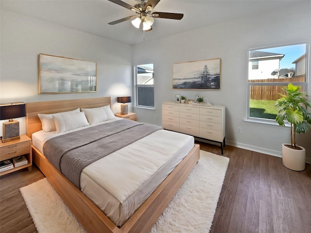 bedroom featuring ceiling fan and dark hardwood / wood-style flooring