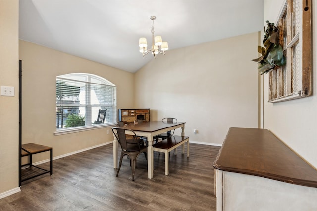 dining space featuring lofted ceiling, dark hardwood / wood-style flooring, and a notable chandelier