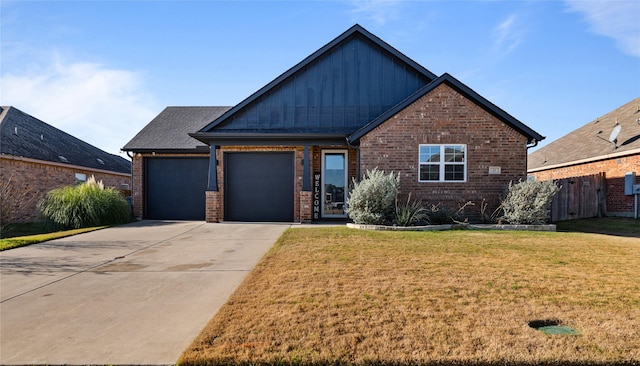 view of front facade with a garage and a front lawn