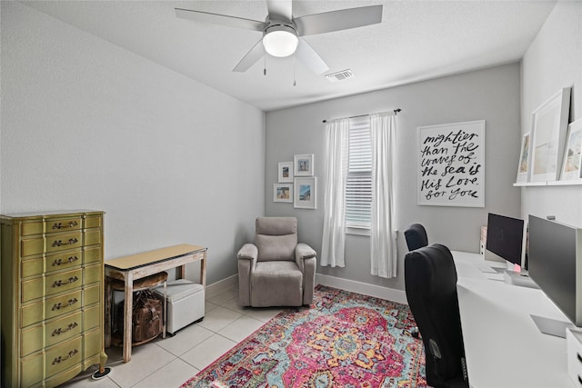 tiled office space with ceiling fan