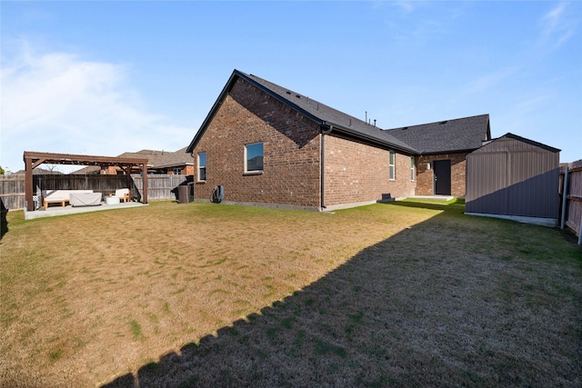 back of property featuring a pergola, a patio area, a yard, and a shed