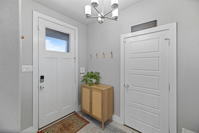 entryway featuring a notable chandelier