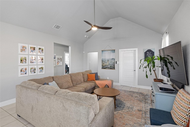 living room featuring ceiling fan, light tile patterned floors, and high vaulted ceiling