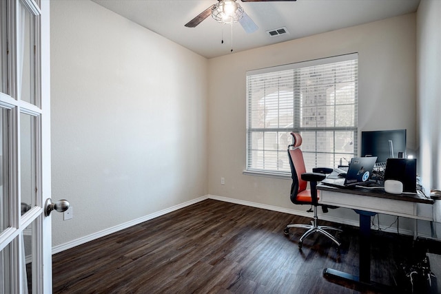 home office with dark hardwood / wood-style floors and ceiling fan