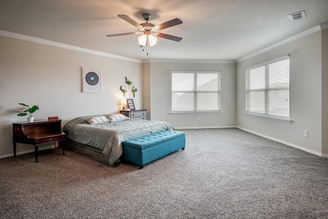 carpeted bedroom featuring ceiling fan, a textured ceiling, and ornamental molding