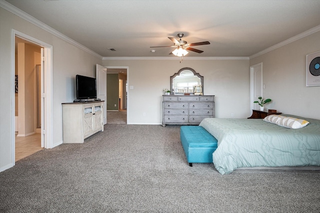 carpeted bedroom with ceiling fan and ornamental molding