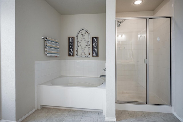 bathroom with separate shower and tub and tile patterned floors