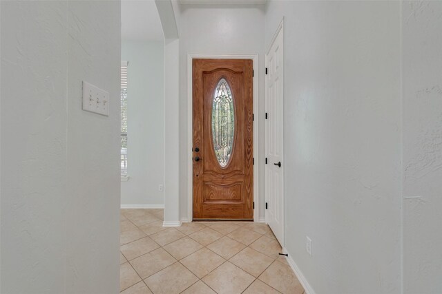 foyer featuring light tile patterned floors