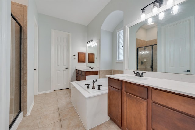 bathroom with separate shower and tub, tile patterned floors, and vanity