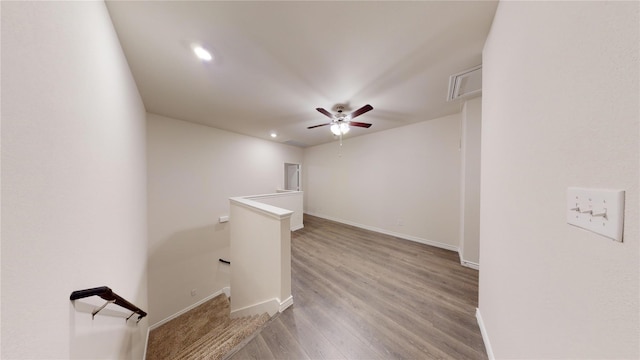 unfurnished room featuring light wood-type flooring and ceiling fan