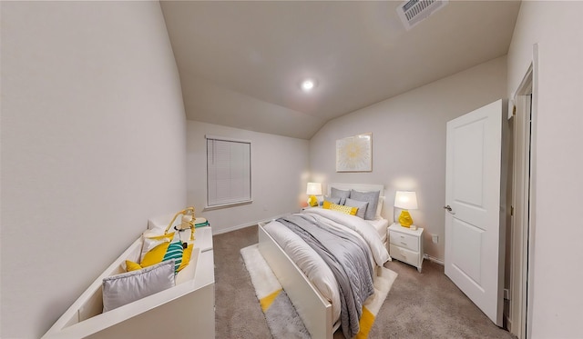 carpeted bedroom featuring vaulted ceiling