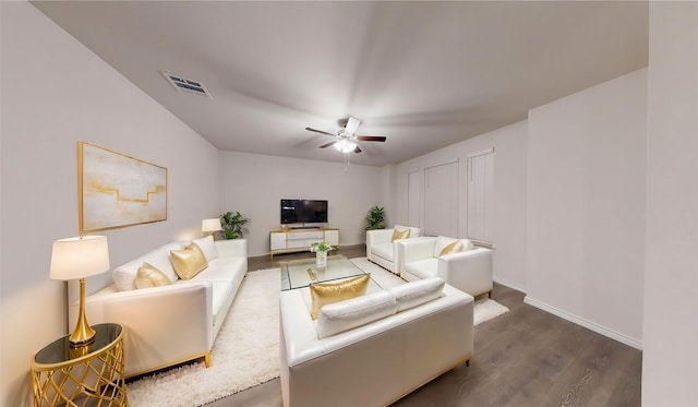 living room featuring dark hardwood / wood-style floors and ceiling fan