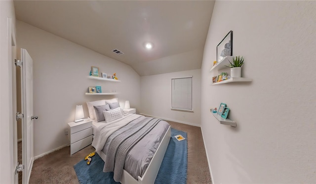 carpeted bedroom with vaulted ceiling