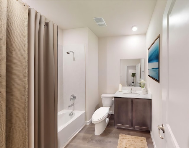 full bathroom with vanity, wood-type flooring, bathtub / shower combination, and toilet