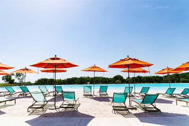 view of patio featuring a water view