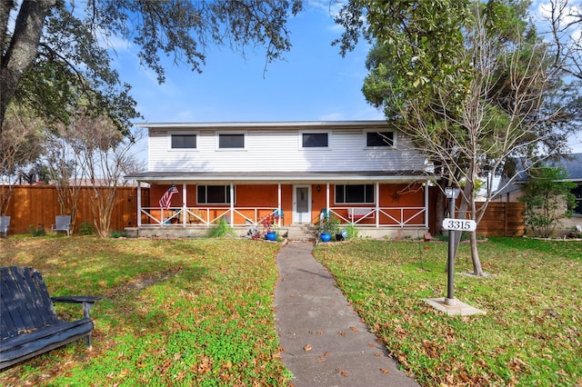 view of front of house featuring a porch and a front yard