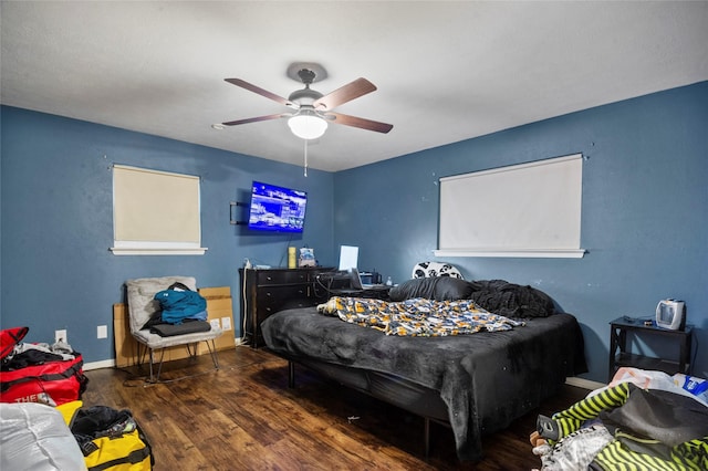 bedroom featuring ceiling fan and dark hardwood / wood-style flooring