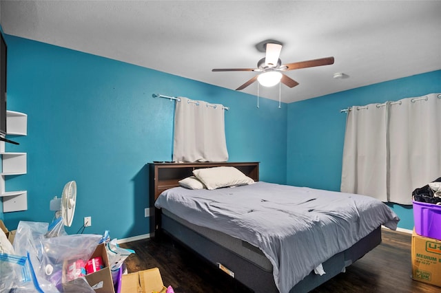 bedroom featuring ceiling fan and dark hardwood / wood-style floors