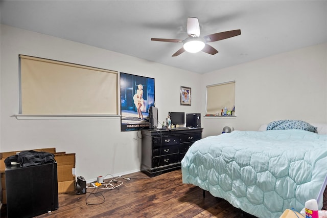 bedroom with ceiling fan and dark wood-type flooring