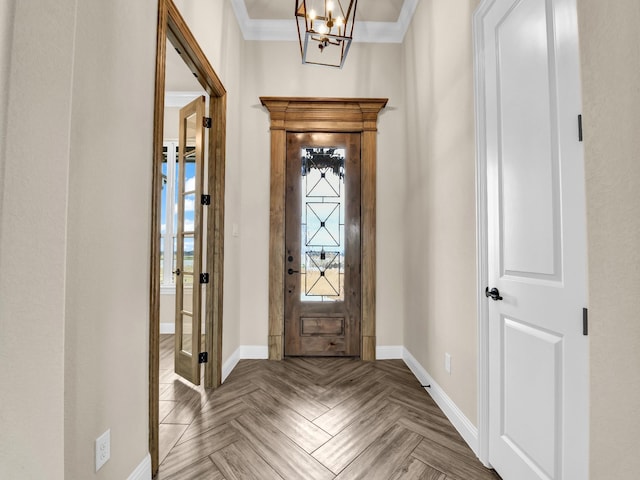 entryway featuring parquet flooring, an inviting chandelier, and ornamental molding