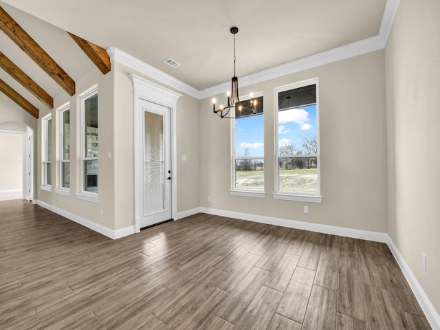 unfurnished dining area featuring a notable chandelier and lofted ceiling with beams