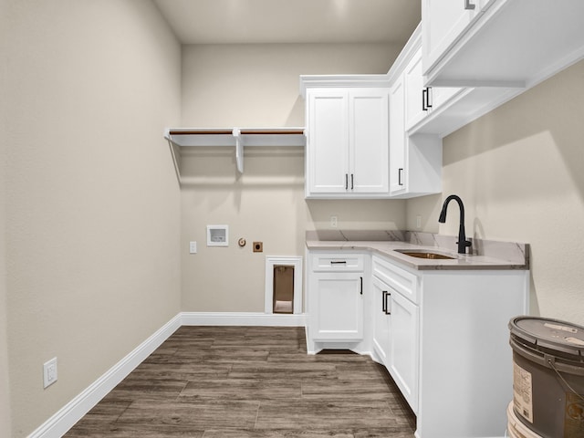 laundry area with sink, cabinets, electric dryer hookup, dark hardwood / wood-style flooring, and hookup for a washing machine