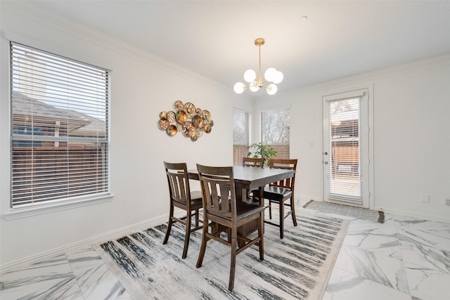 dining space with crown molding and an inviting chandelier