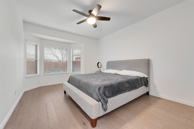 bedroom featuring hardwood / wood-style flooring and ceiling fan