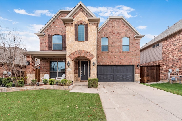 front of property with a garage and a front lawn