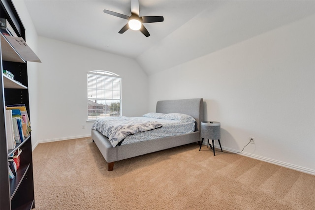 bedroom with light carpet, ceiling fan, and lofted ceiling