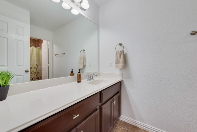 bathroom with tile patterned flooring and vanity