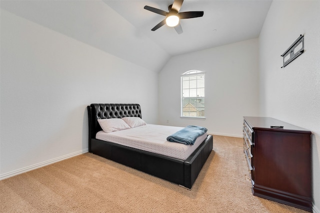 bedroom with light colored carpet, ceiling fan, and lofted ceiling