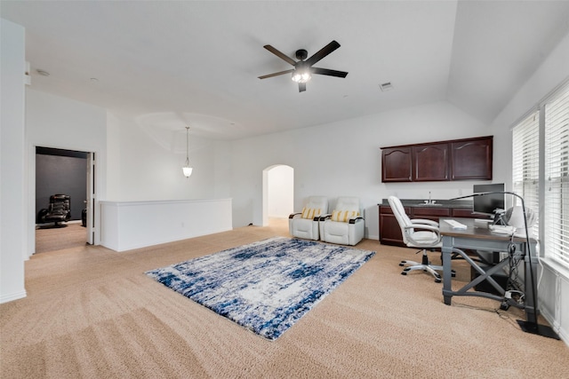 office with ceiling fan, light colored carpet, and vaulted ceiling