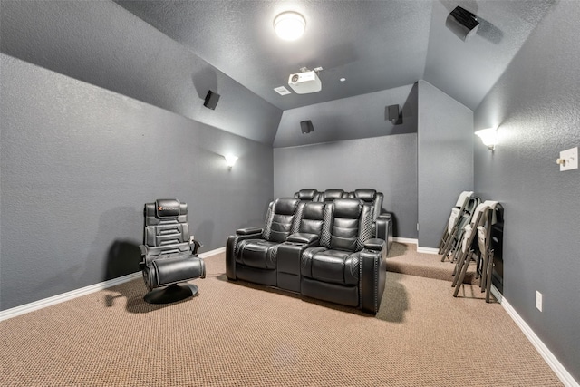 home theater room with light carpet and lofted ceiling