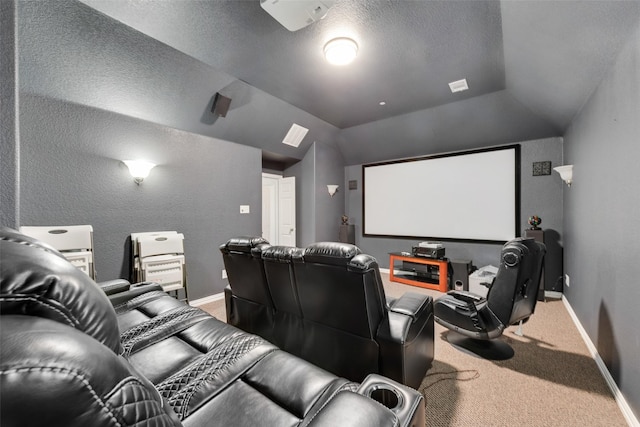 carpeted cinema room with a textured ceiling and lofted ceiling