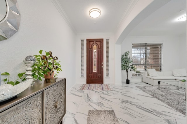 entryway featuring ornamental molding