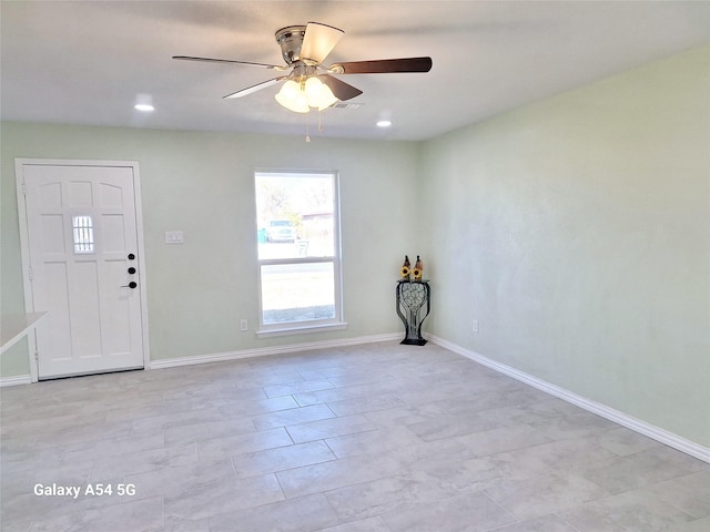 entrance foyer featuring ceiling fan