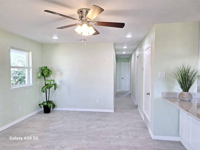 spare room with ceiling fan