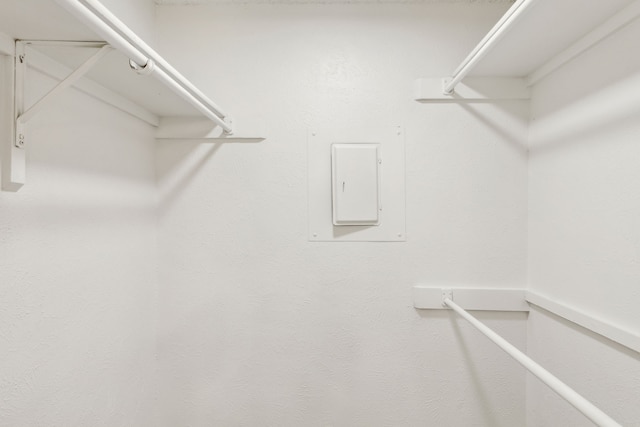 spacious closet featuring electric panel